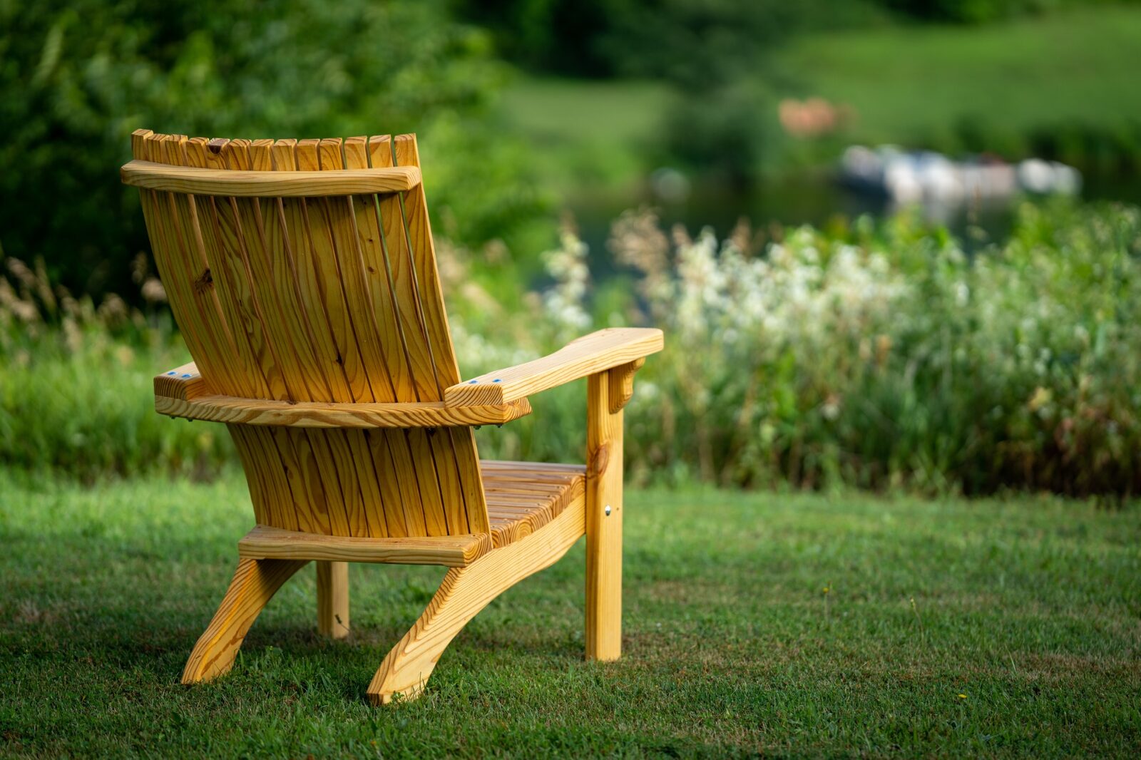 The Briar Patch Adirondack chair — contoured high back, slatted, in southern yellow pine