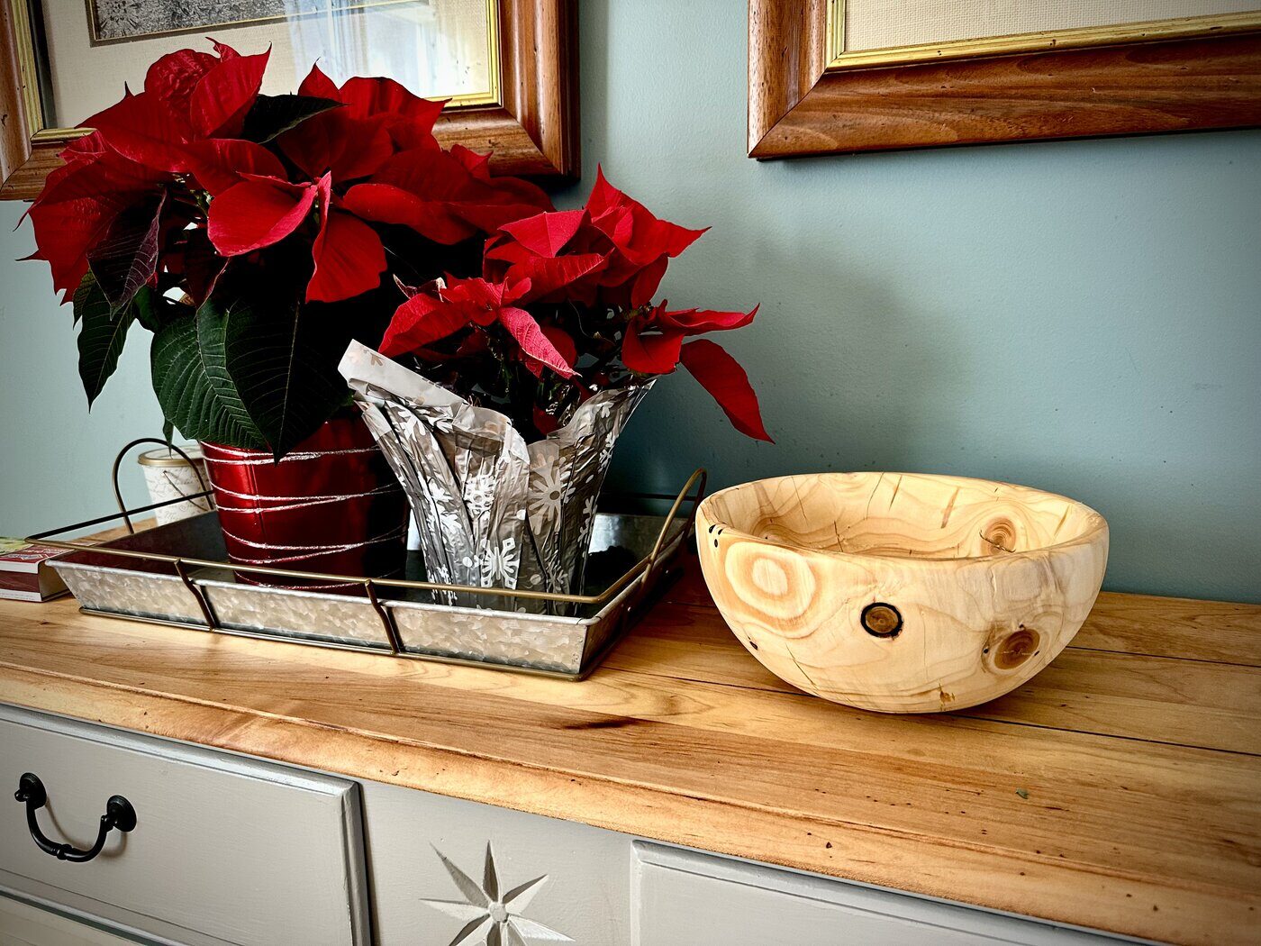 A hand-turned wooden bowl with natural knot inclusions